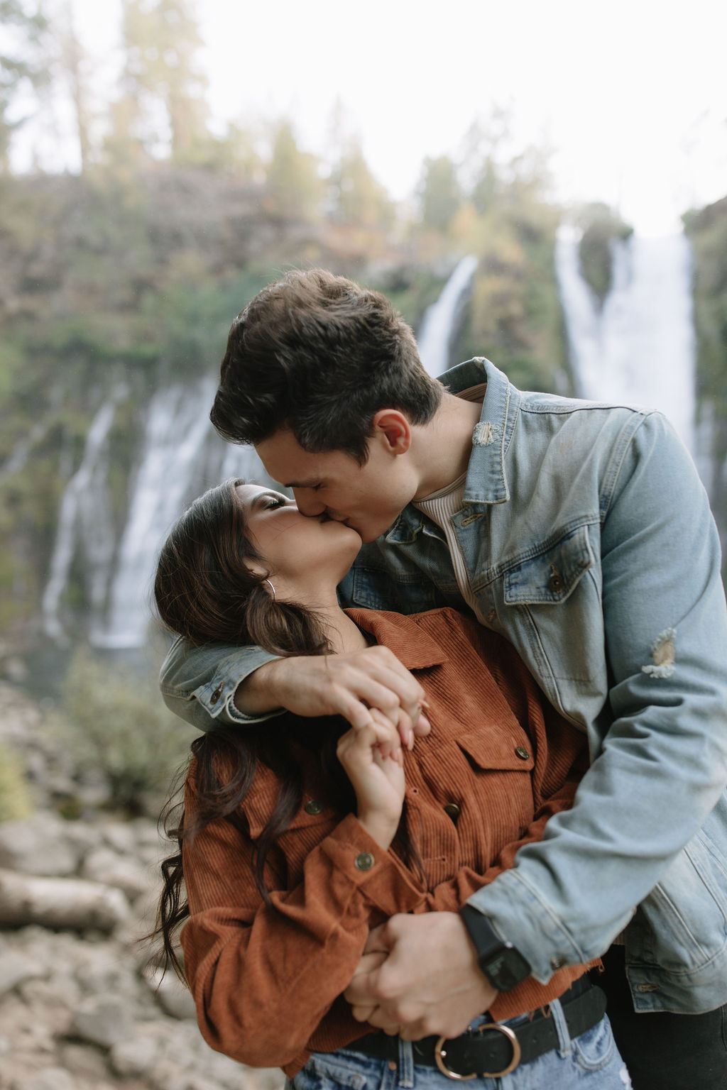 Couple kissing during their engagement photoshoot