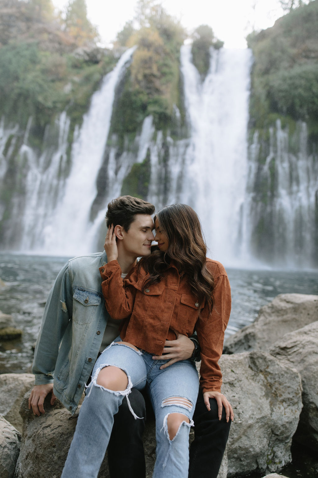 Couple posing with their foreheads touching for their engagement photoshoot