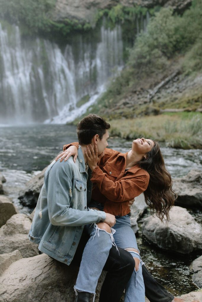 Girl throwing her head back laughing during engagement photoshoot