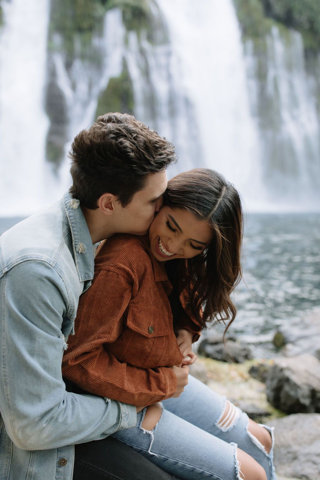 Couple laughing during engagement photoshoot