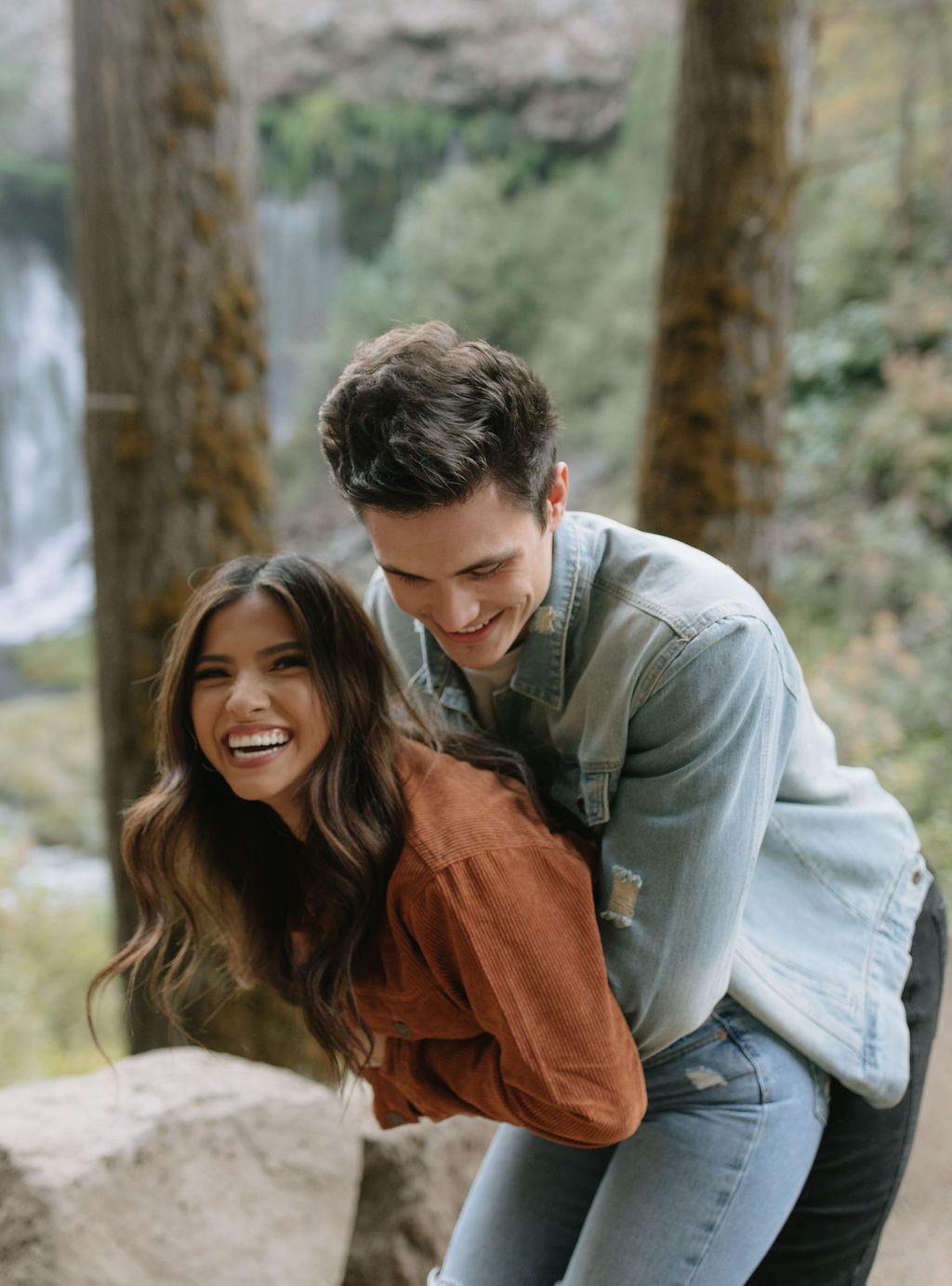 Couple photo with man hugging his fiancee from behind