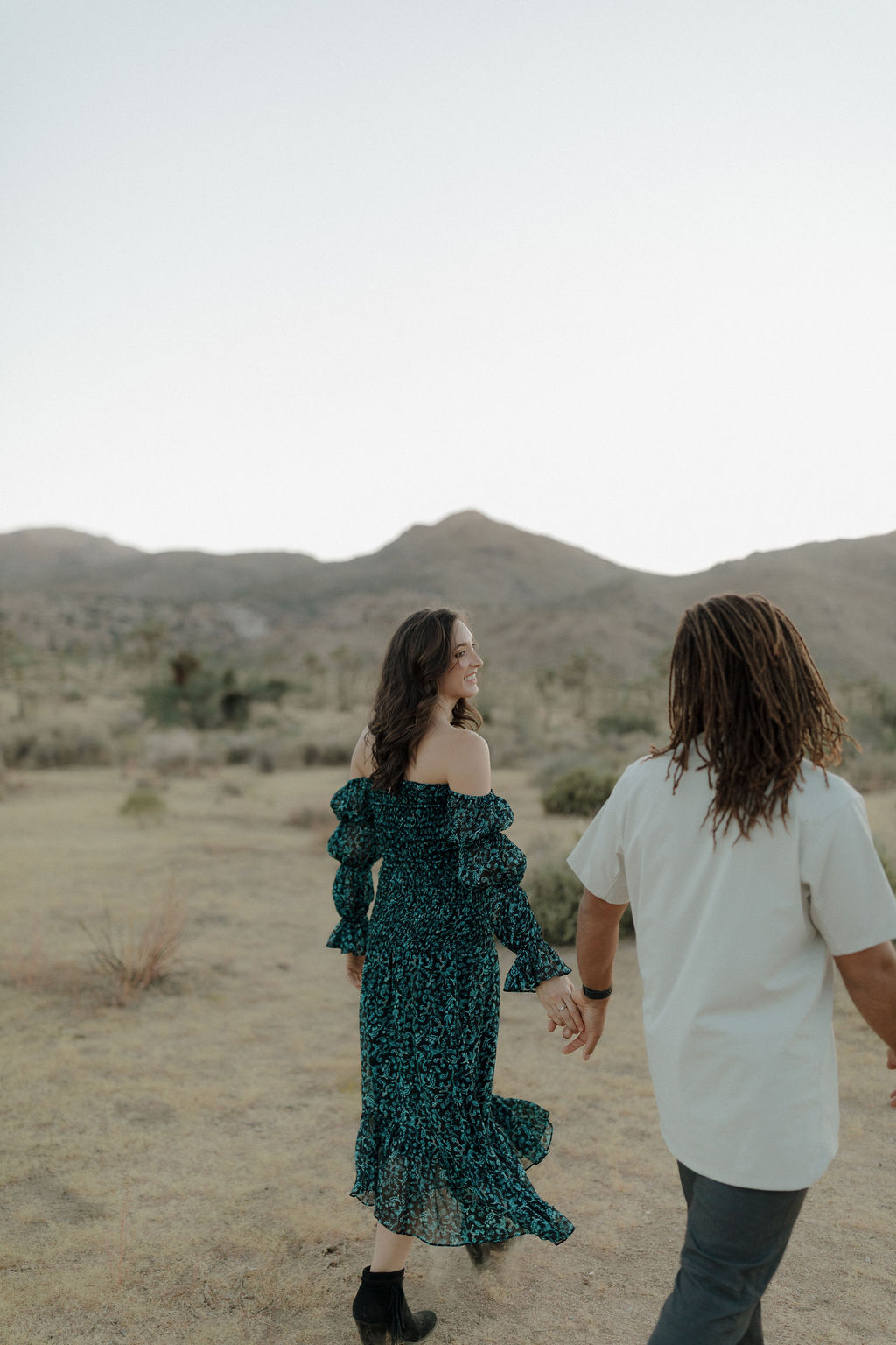 A couple posing for a Joshua Tree photoshoot