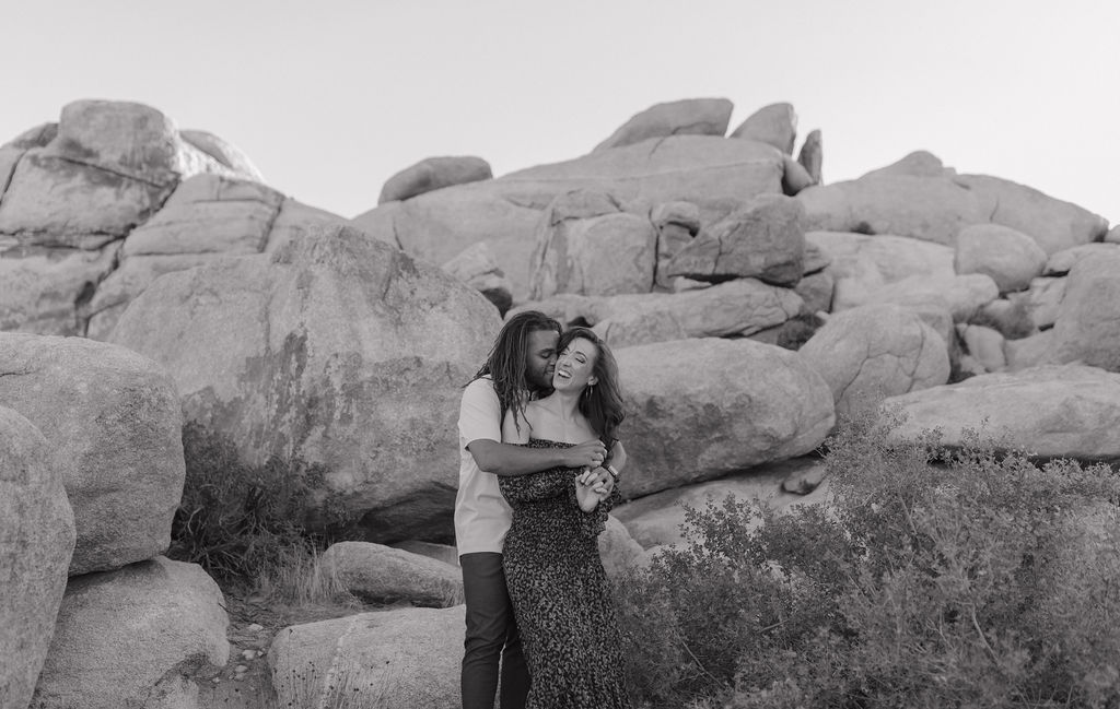A black and white photo of an engaged couple from a Joshua tree photoshoot