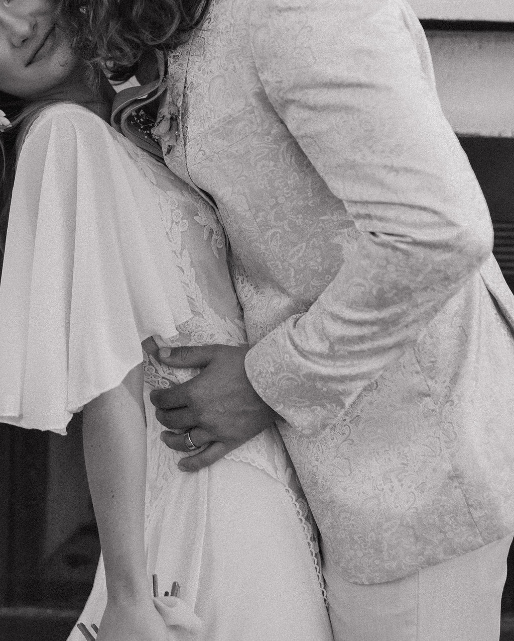 An up close photo of a bride and groom