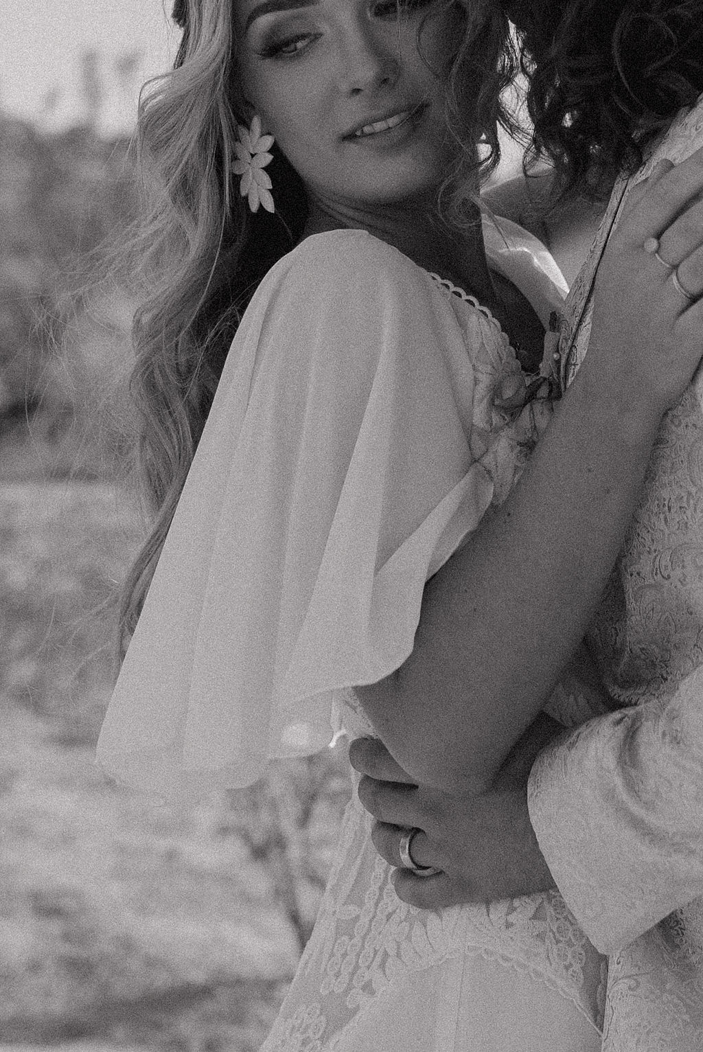 The sleeves from a boho wedding gown at a Joshua tree elopement