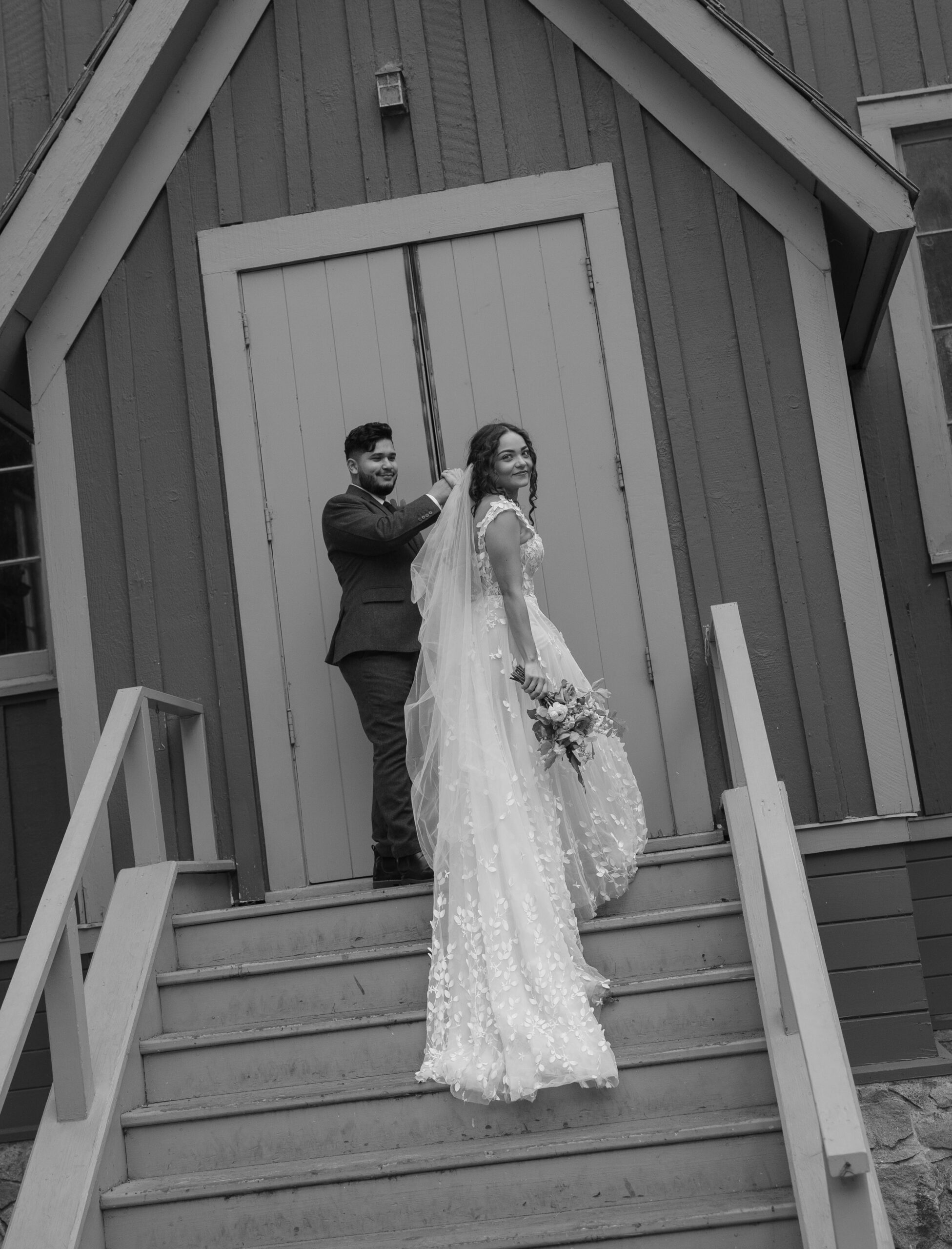 Bride and groom walking up to chapel doors together at Yosemite National Park wedding