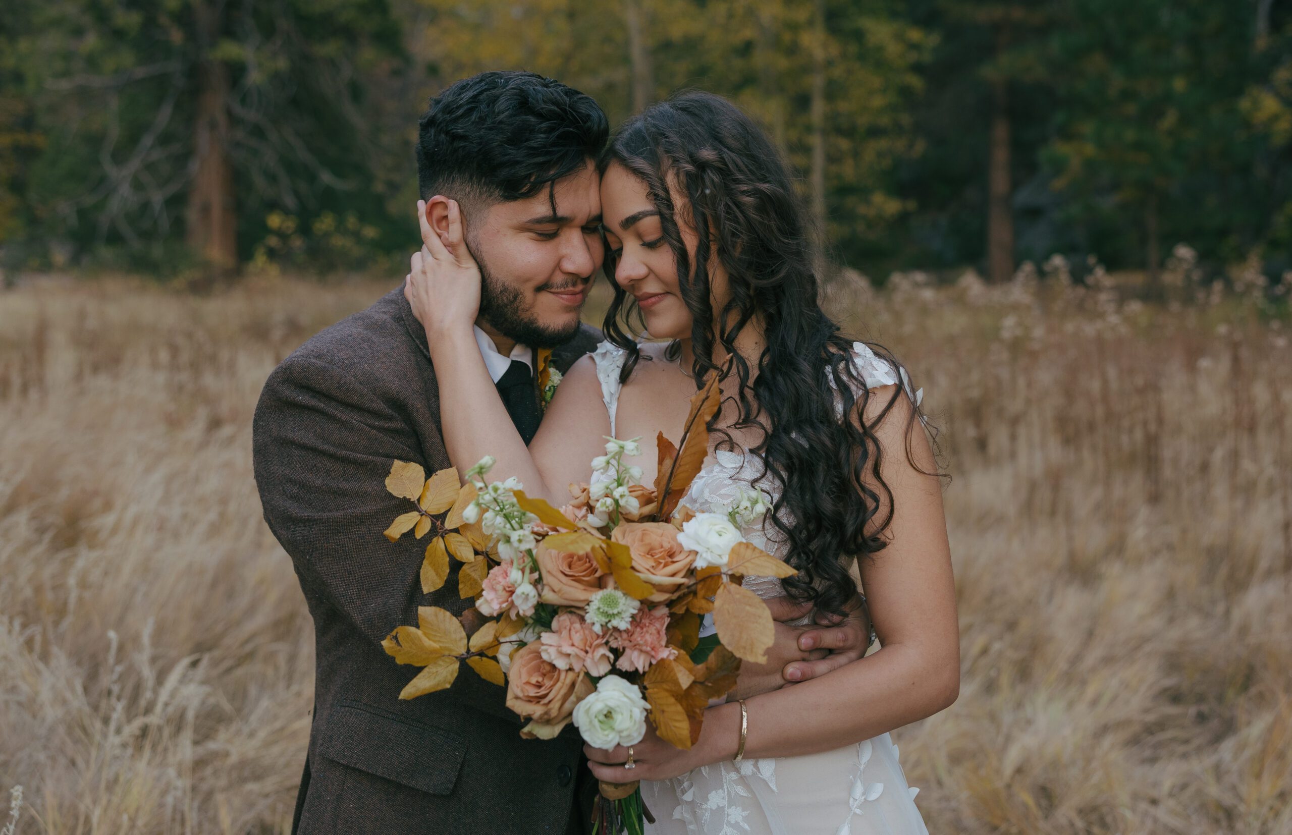 Romantic bride and groom photo with fall wedding bouquet at Yosemite elopement