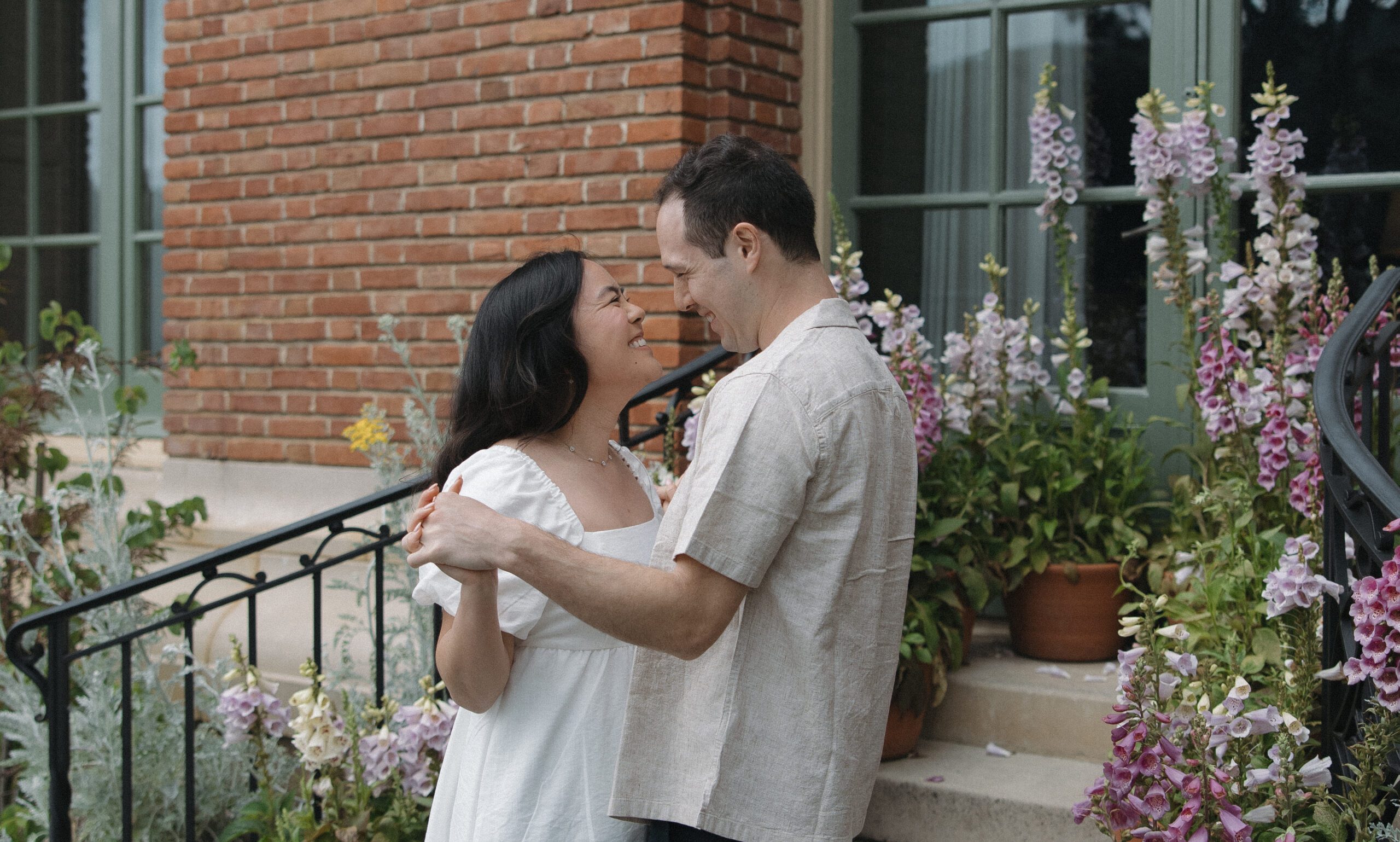 Couple smiling at each other in romantic engagement photos