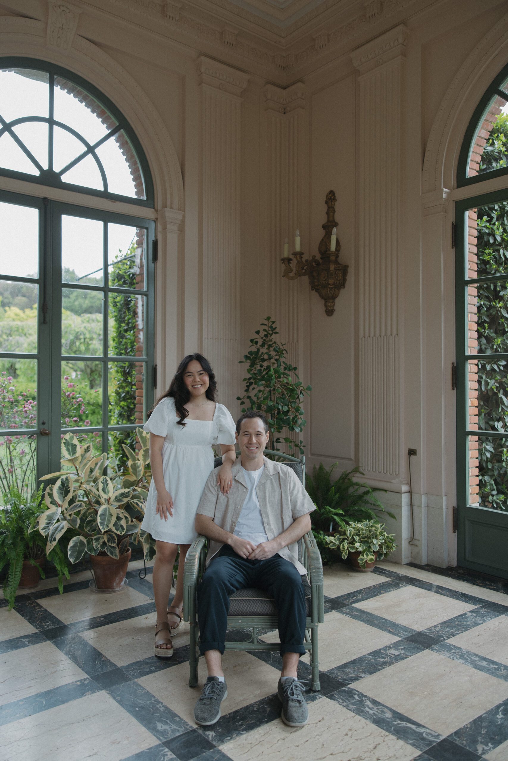 Engagement photos in sunroom at Filoli Gardens