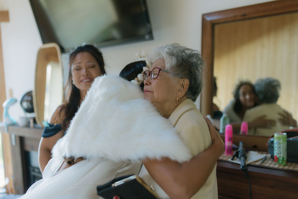 Bride hugging her grandma in emotional documentary wedding photo
