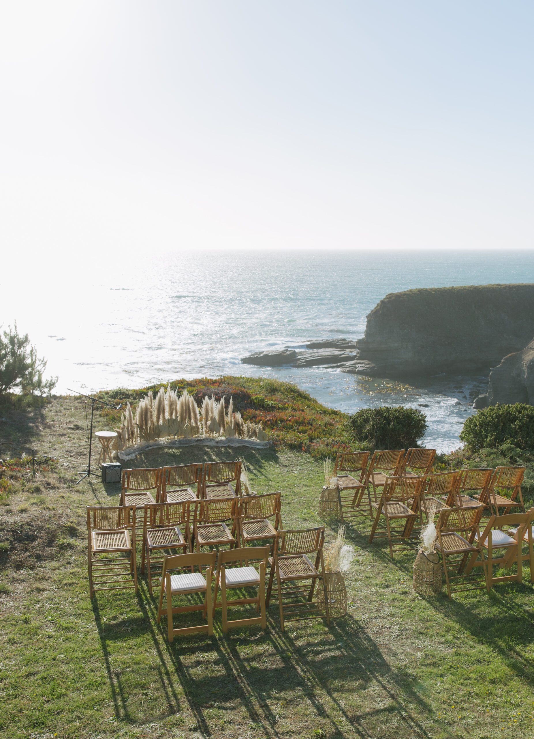 Bay Area wedding ceremony setup in front of ocean on a cliff