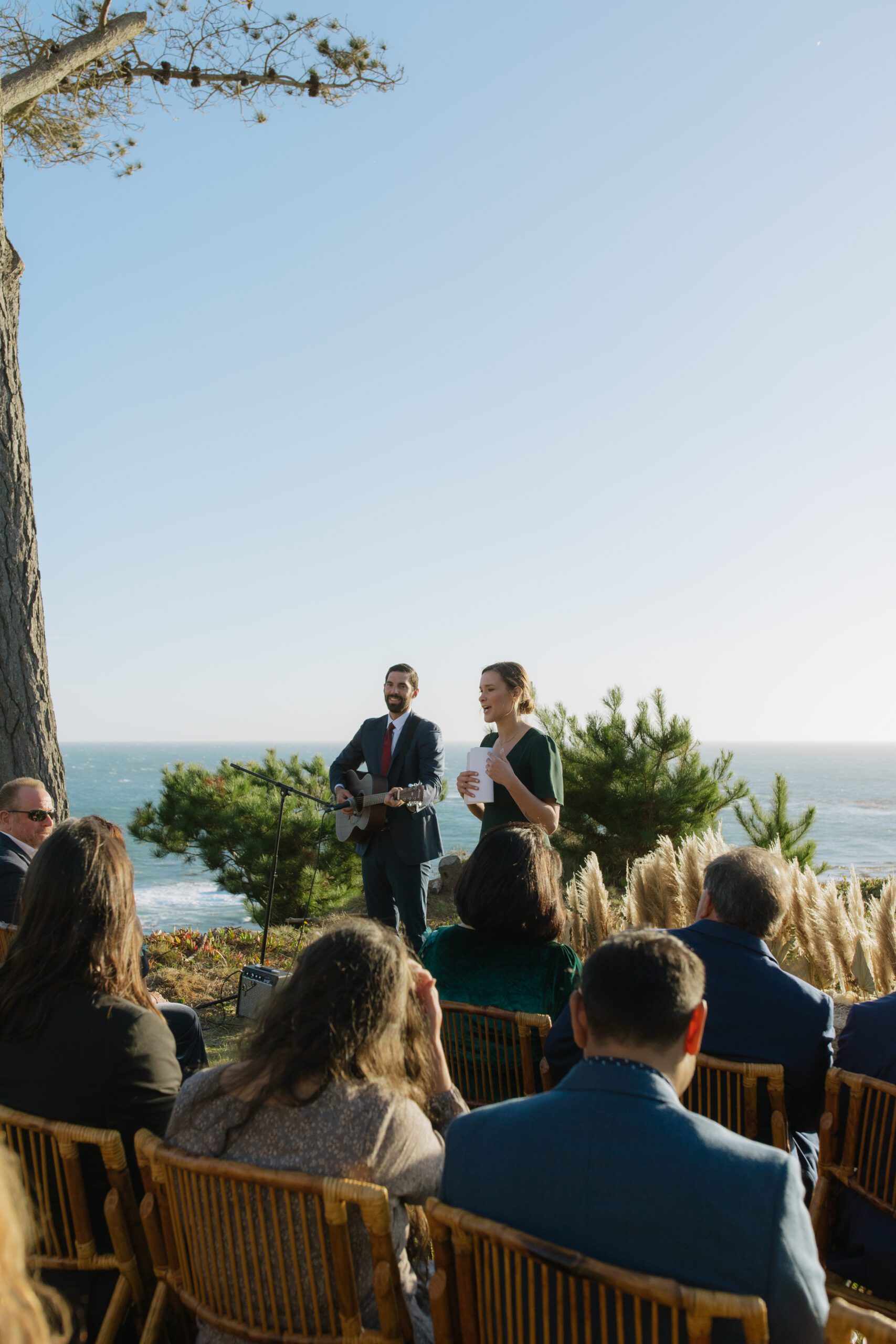 Wedding ceremony photo of live music and officiant from Bay Area oceanfront wedding