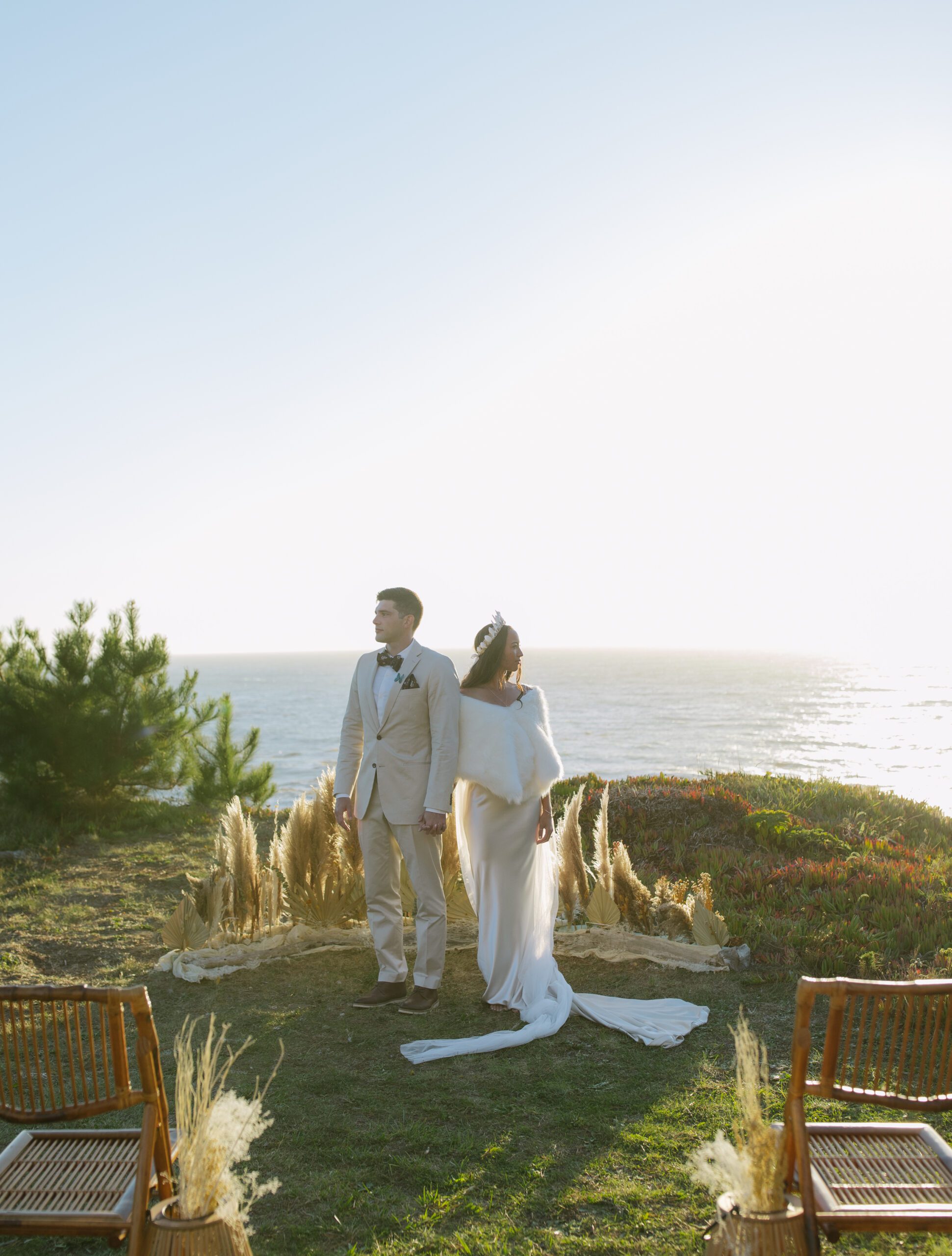 Editorial bride and groom photo of bride and groom looking away from each other on Bay Area coast
