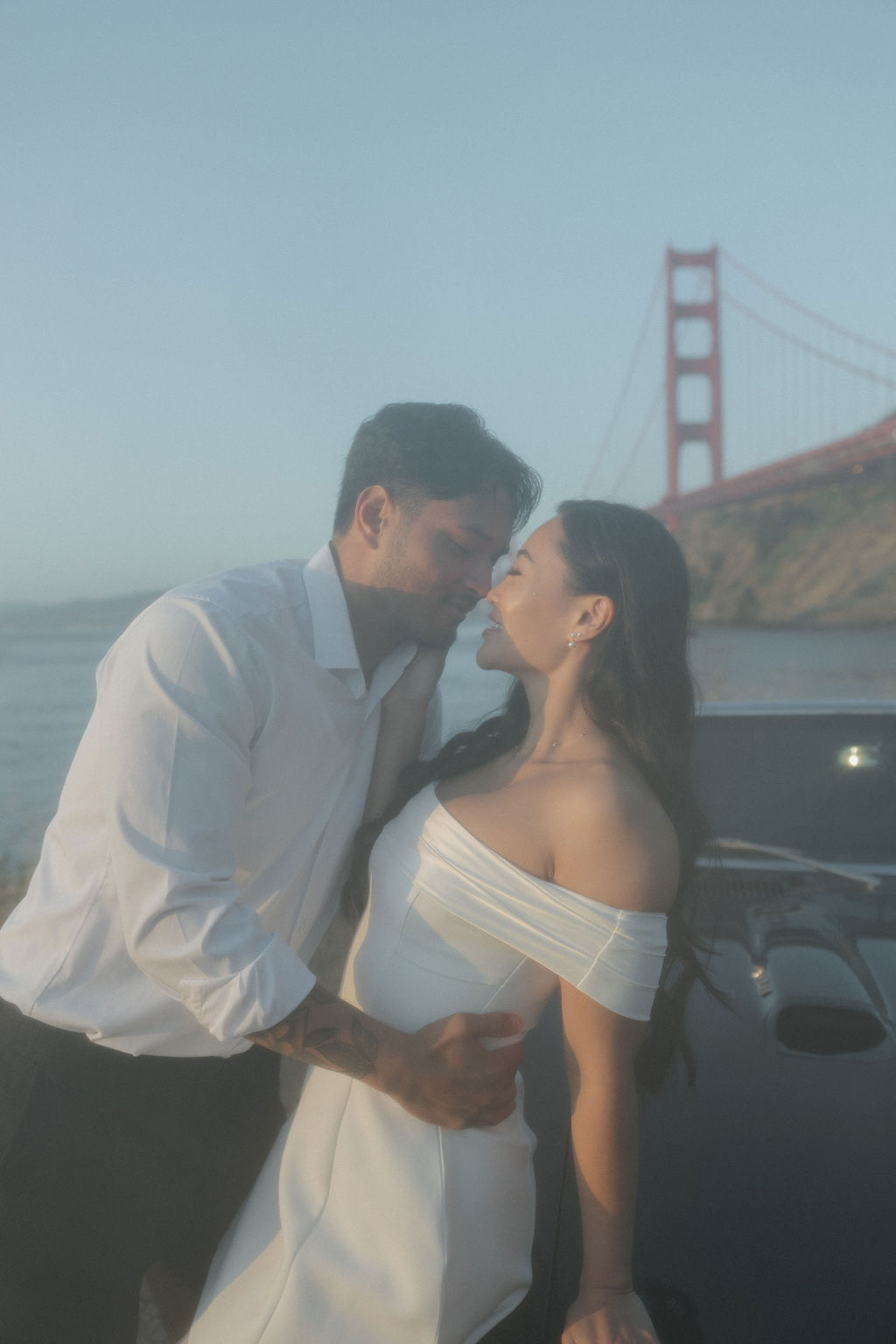 Hazy engagement photo in front of the golden gate bridge