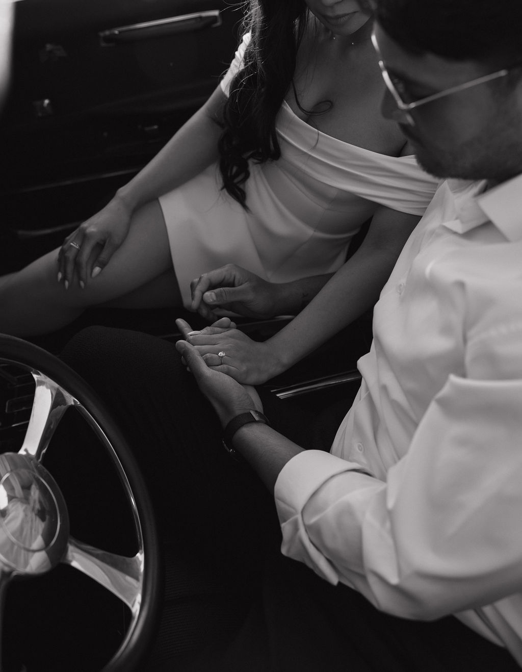 Editorial Black and white engagement photo inside of classic car