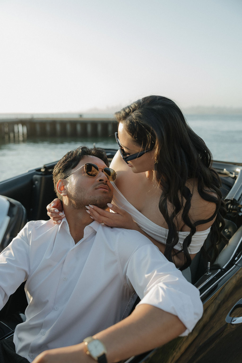 Bride and groom leaning in for a kiss during engagement photoshoot