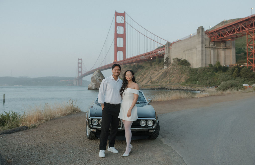 Golden gate photoshoot for engagement photos in front of a classic car