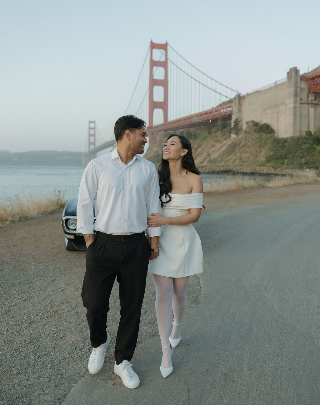 Couple walking towards the camera during Golden Gate Bridge photoshoot