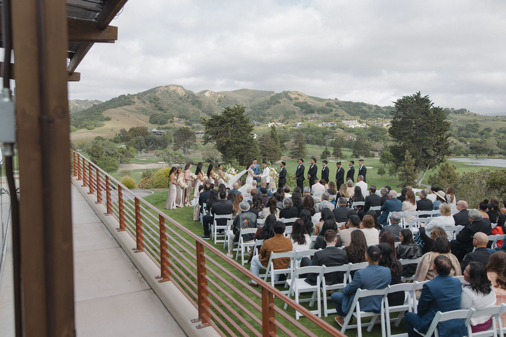 Ceremony photo from Monterey wedding venue with arial view of guests and bride and groom