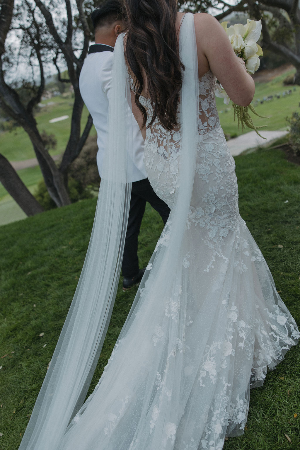 Editorial wedding photos of bride and groom walking away from ceremony