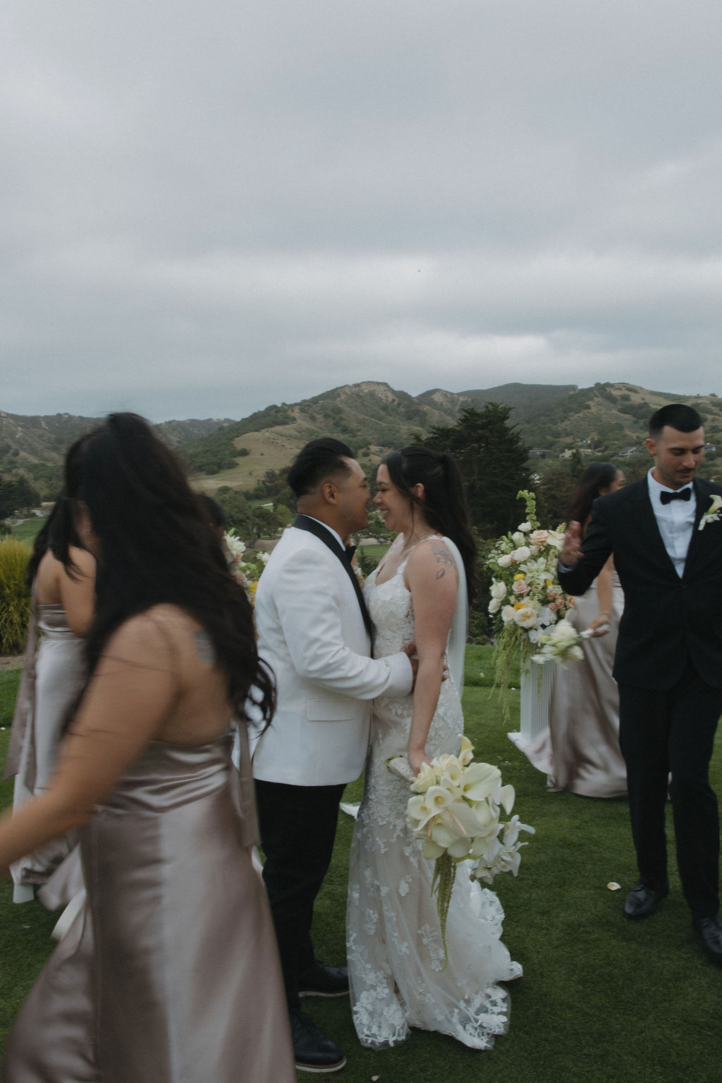 Bridal party photo of bridal party walking around bride and groom in a circle