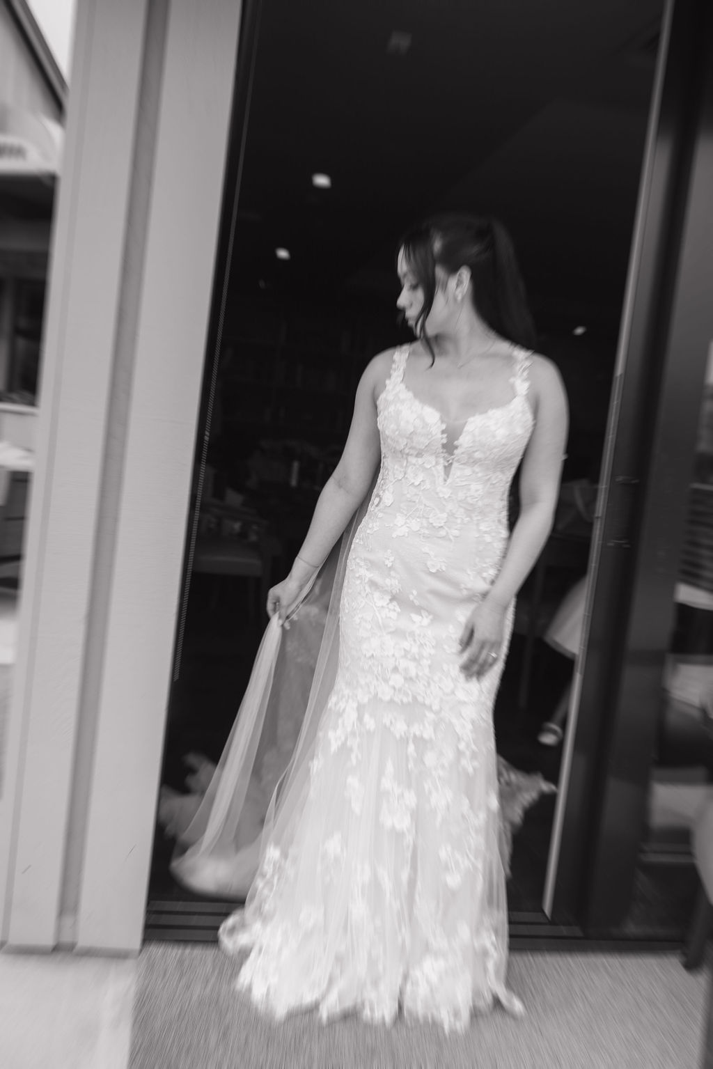 Editorial bridal portrait in a black and white blurry photo showing off her wedding dress