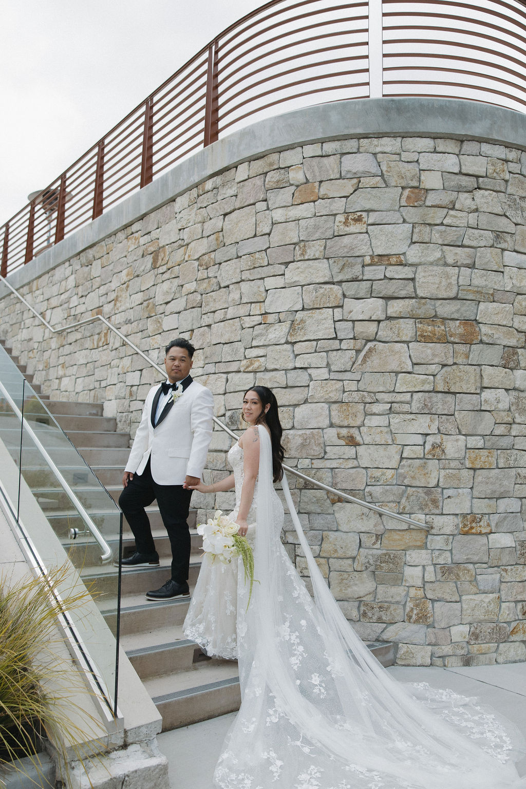 Bride and groom photo walking up the stairs