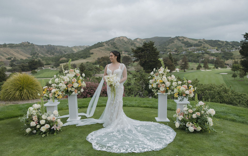Bridal portrait at ceremony site with pastel florals and lily bridal bouquet