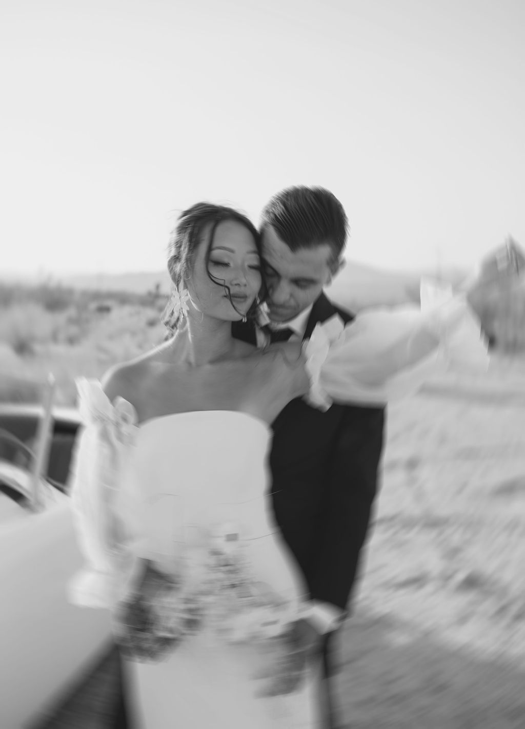 Blurry black and white bride and groom photo from Joshua tree elopement 