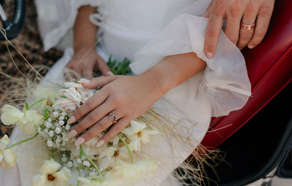Wedding photo of wedding flowers and up close of wedding ring 