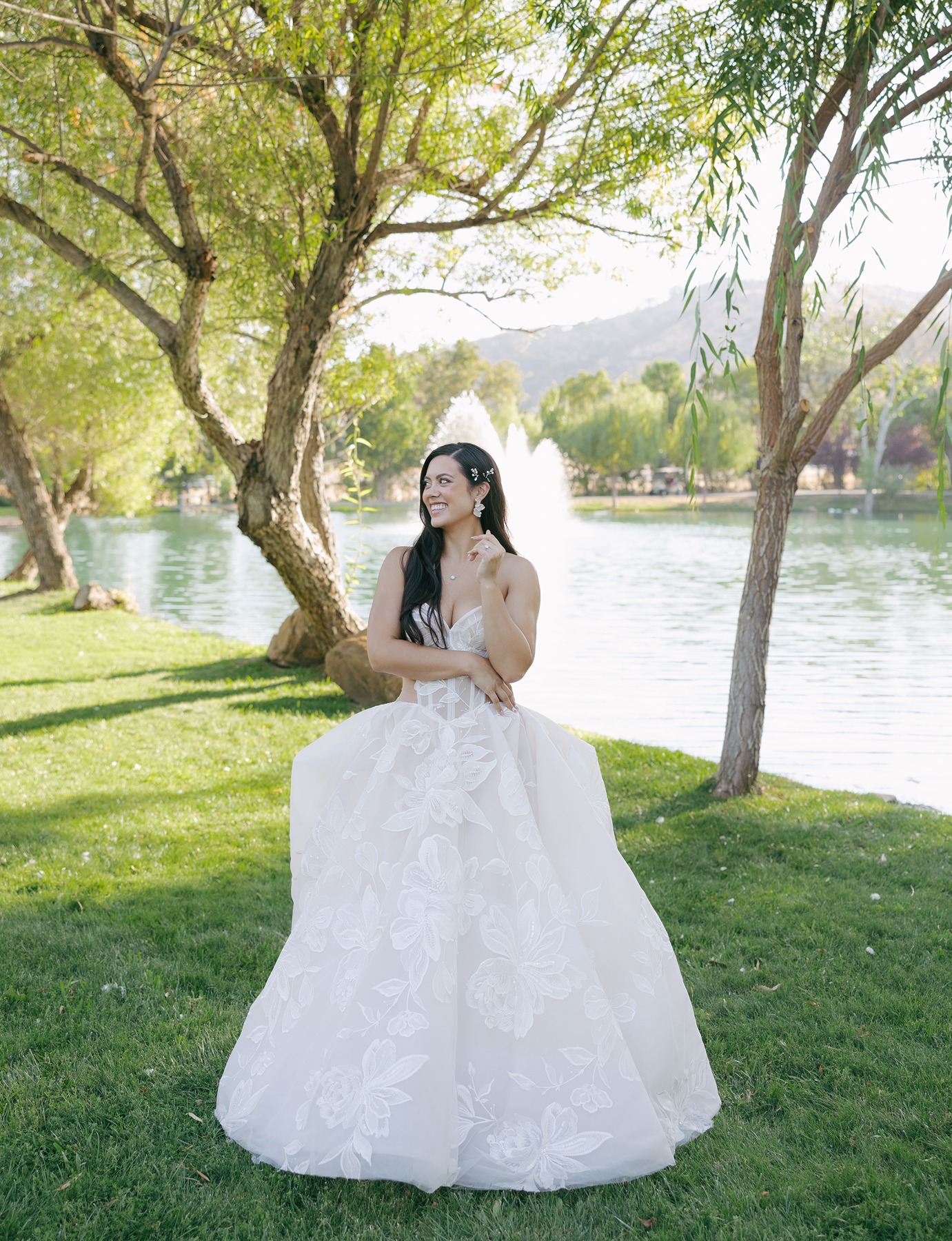 Bridal portrait with bride in front of water fountain in ballgown wedding dress