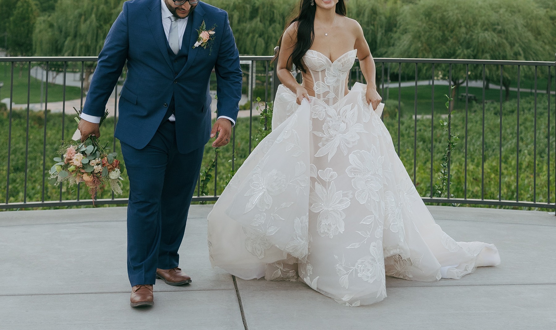 Bride and groom editorial wedding photo running towards the camera