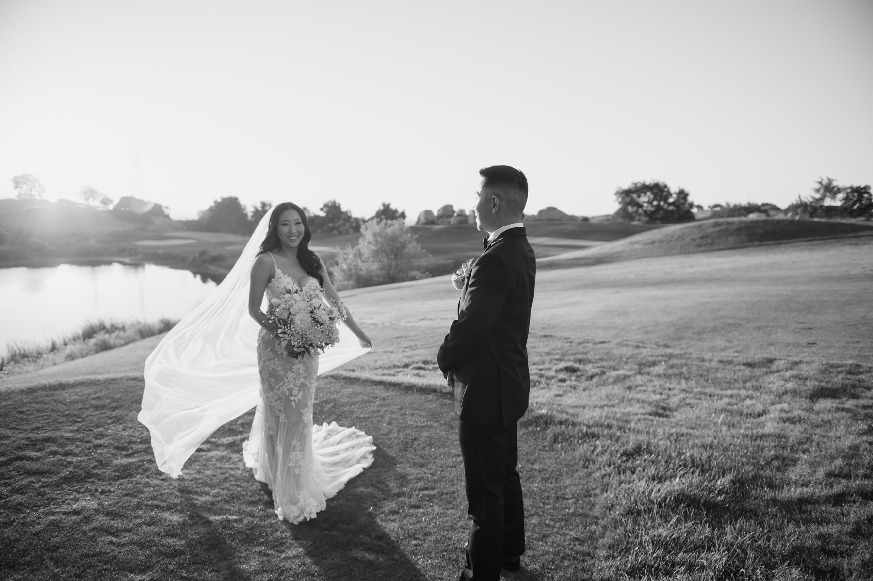 Black and white wedding photo of bride and groom on a. golf course at a San Jose wedding venue