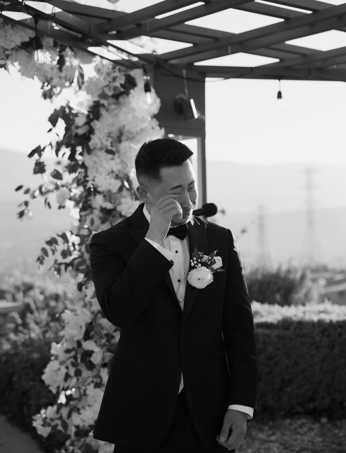 Groom crying as his bride walks down the aisle