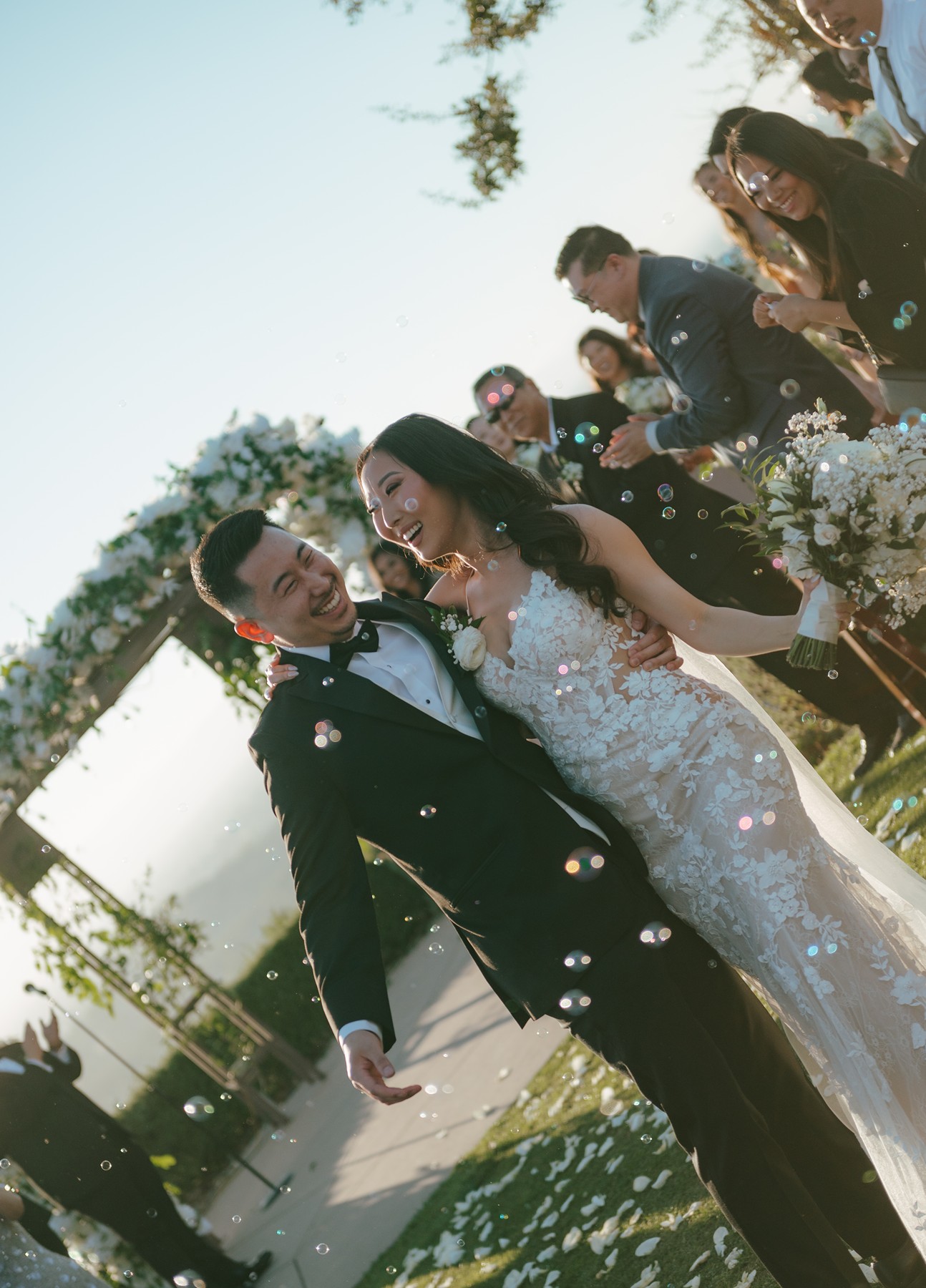 Bride and groom exiting the ceremony laughing and smiling