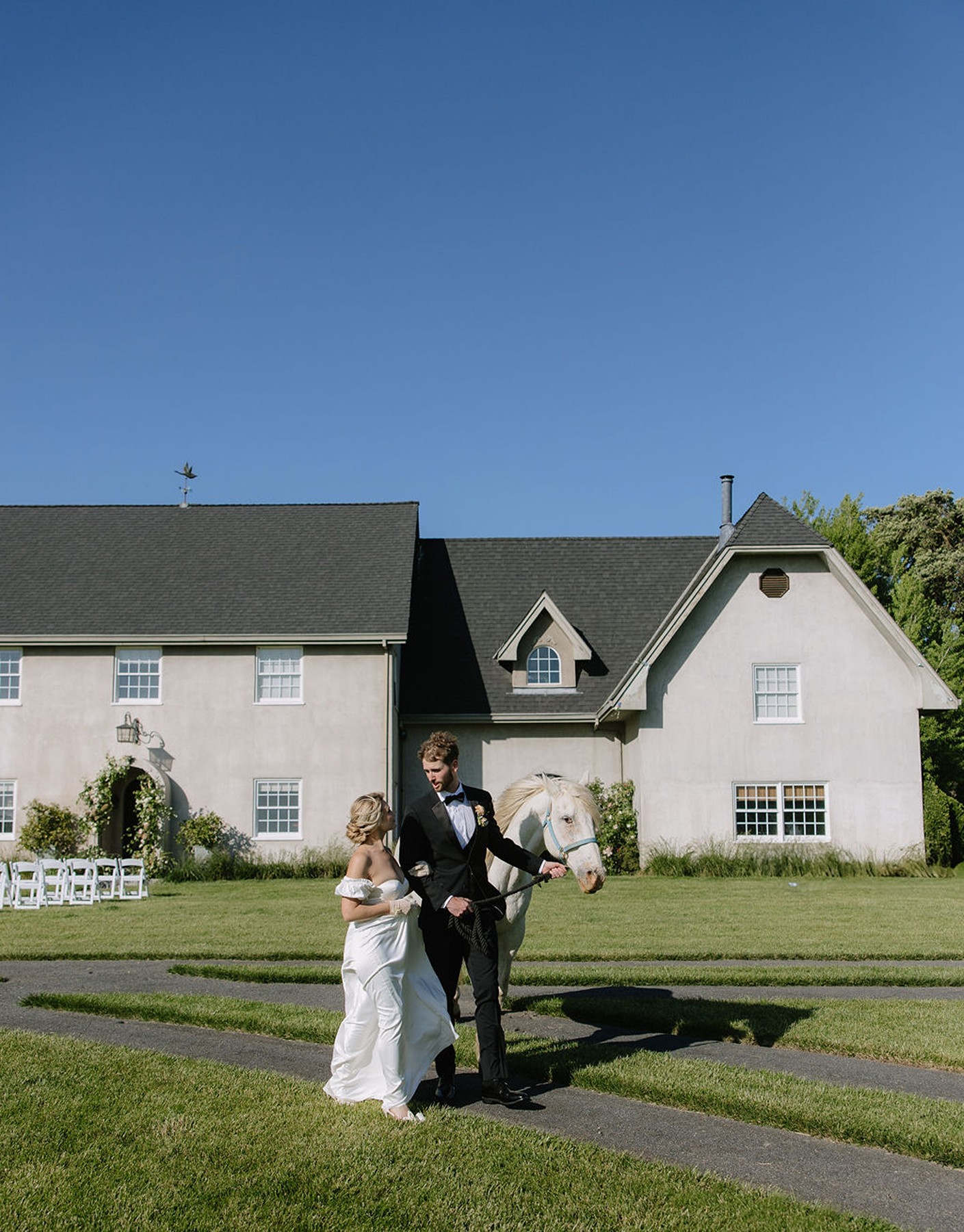 Bride and groom walking in front of a country estate Northern California wedding venue