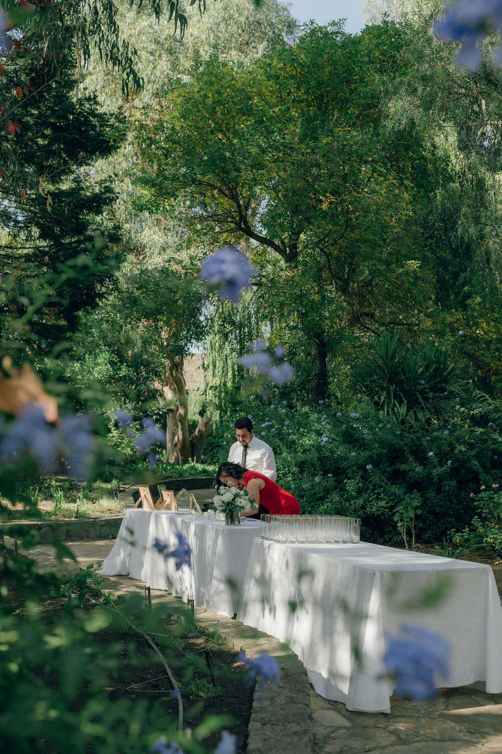 Candid wedding photo of wedding guests signing guest book
