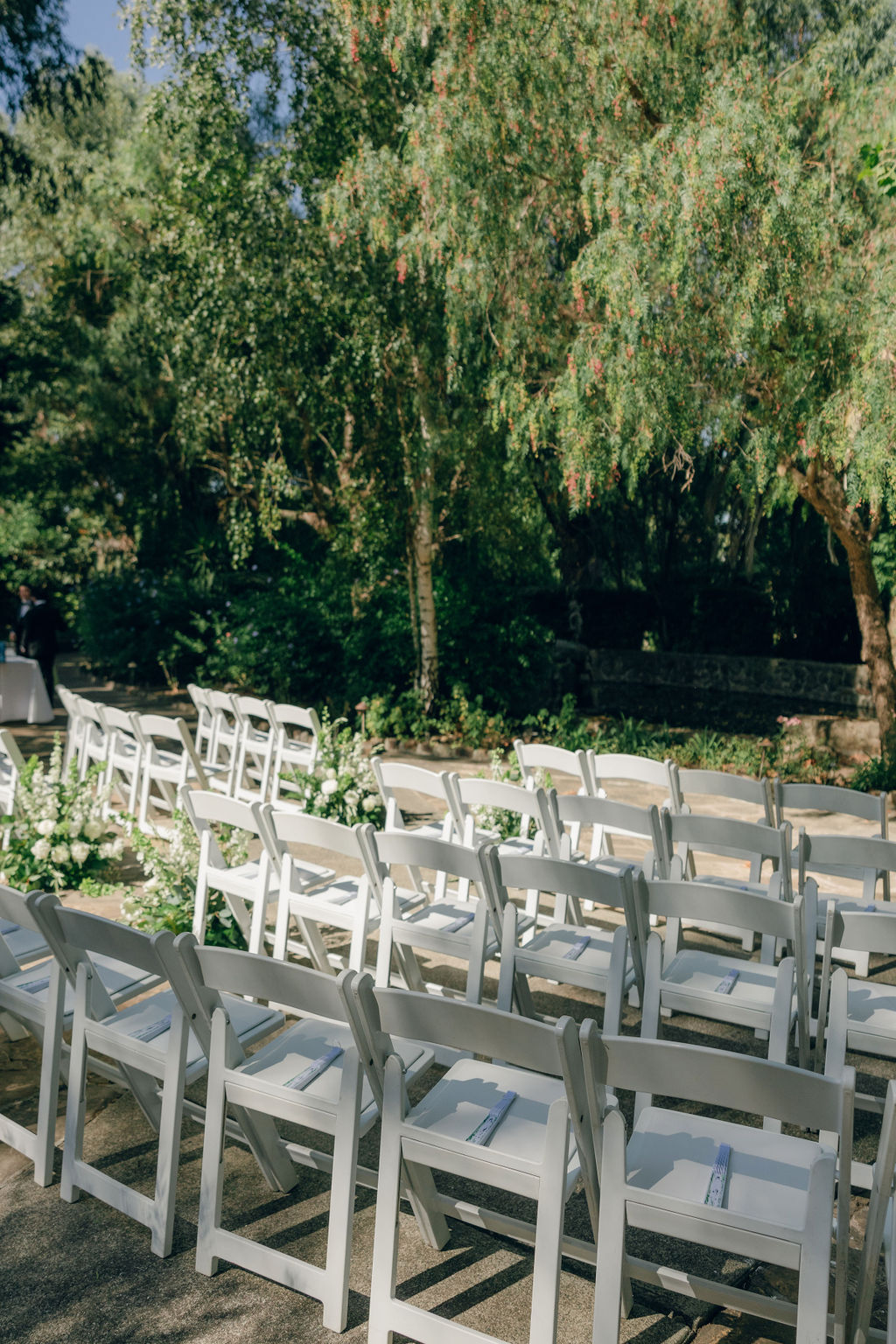 Wedding ceremony setup with curved chairs