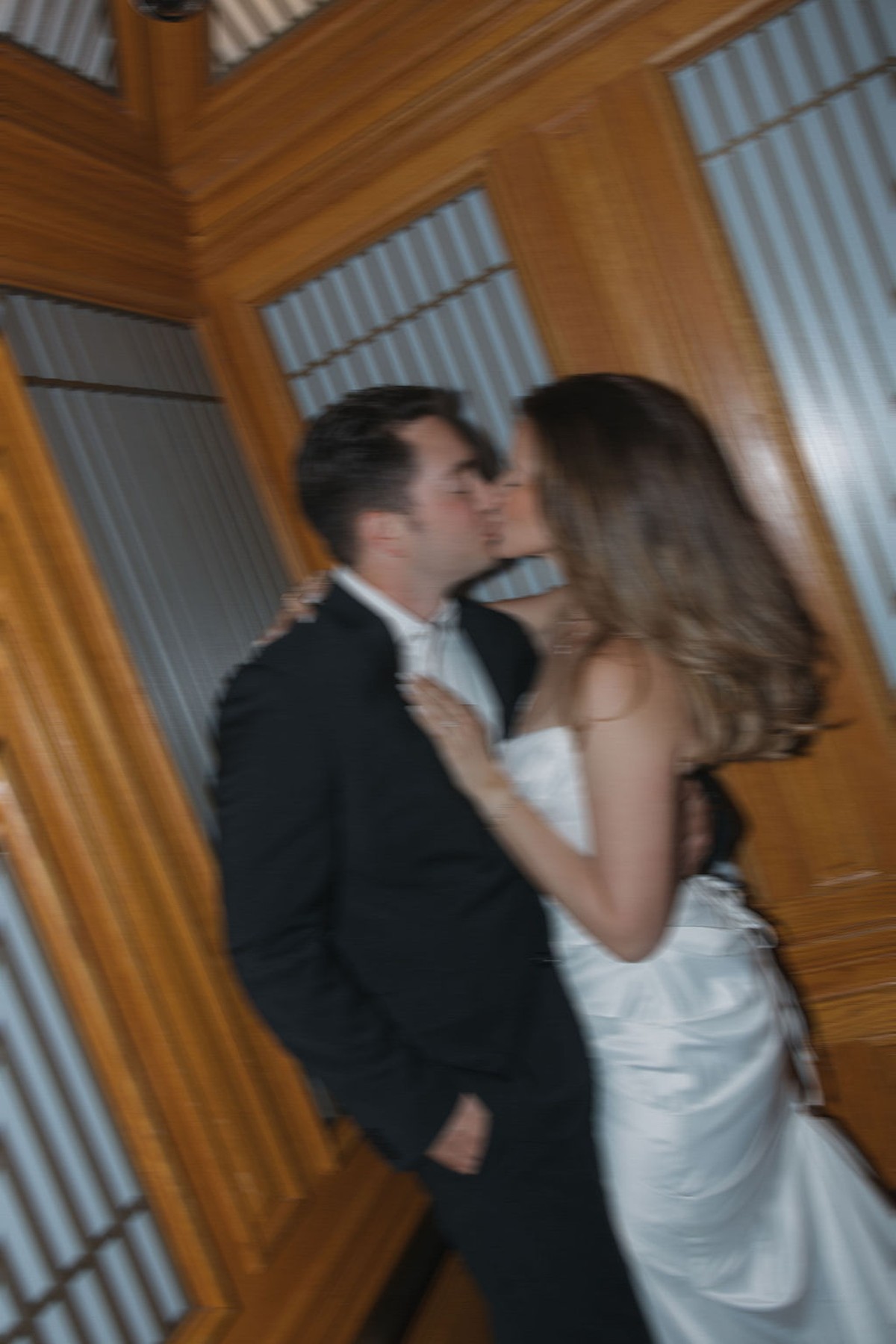 Couple kissing in an elevator after their San Francisco City Hall elopement