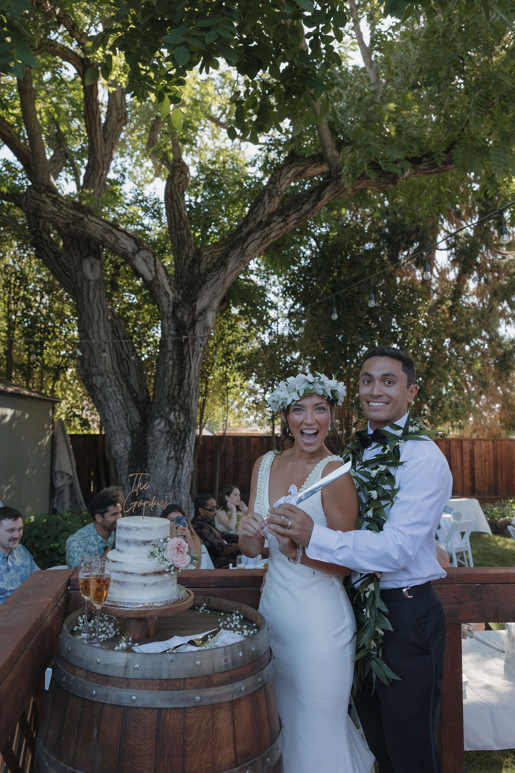 Bride and groom smiling before their cake cutting