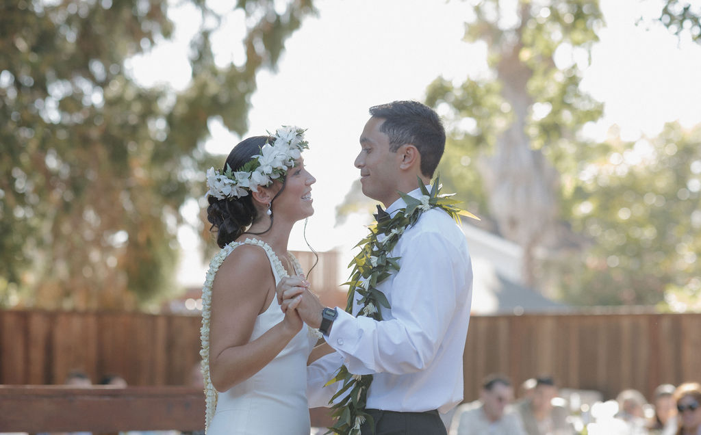 Bride and groom sharing their first dance in a candid wedding photo