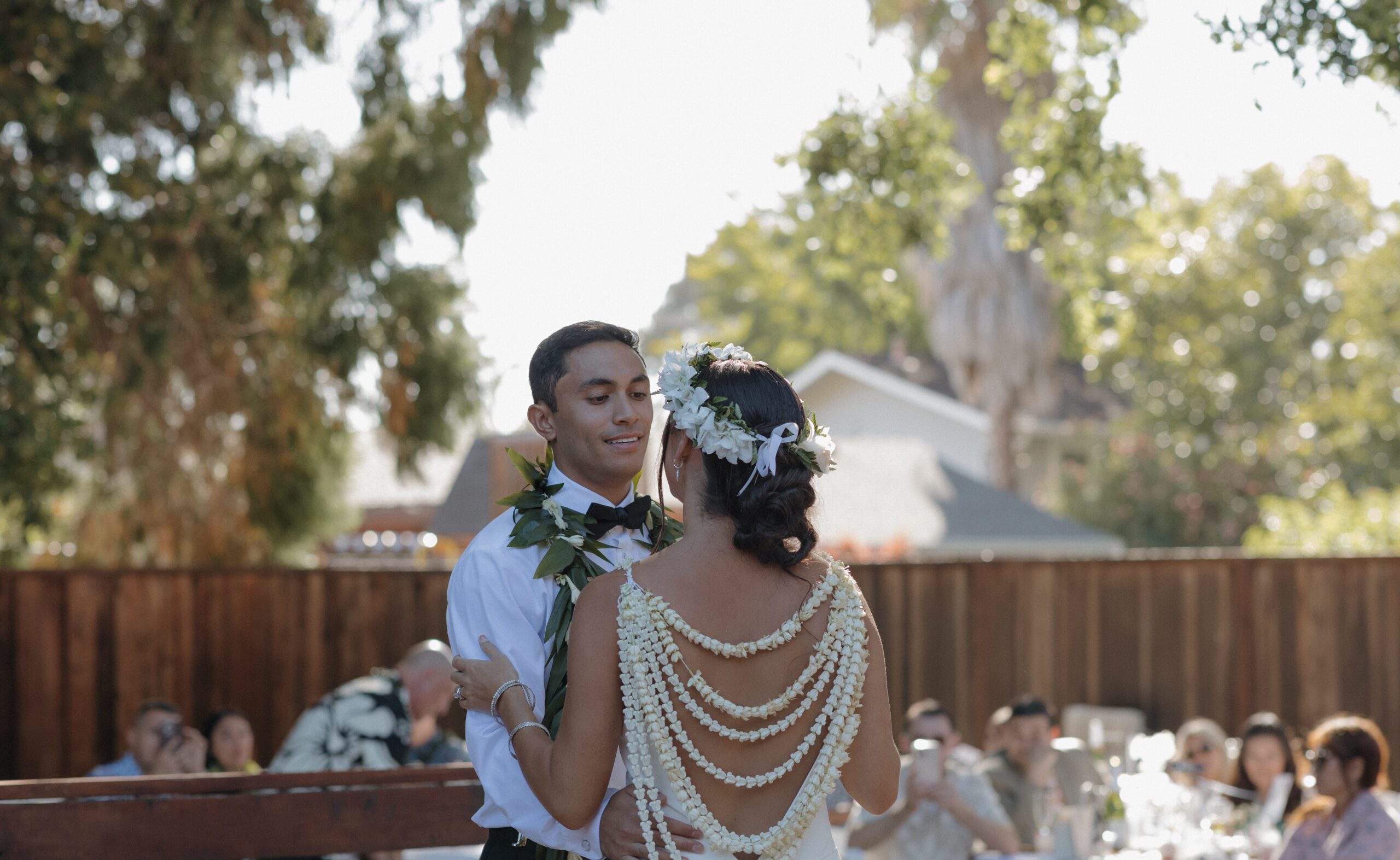 Bride and groom dancing on a deck