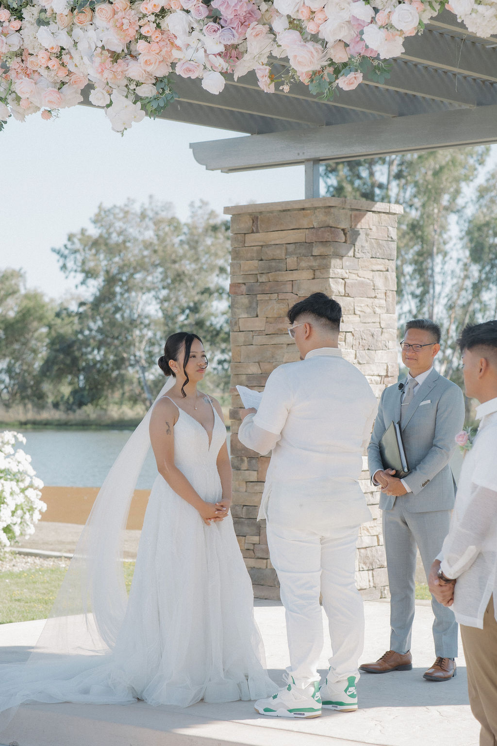 A photo of the bride and groom during vows at their wedding ceremony