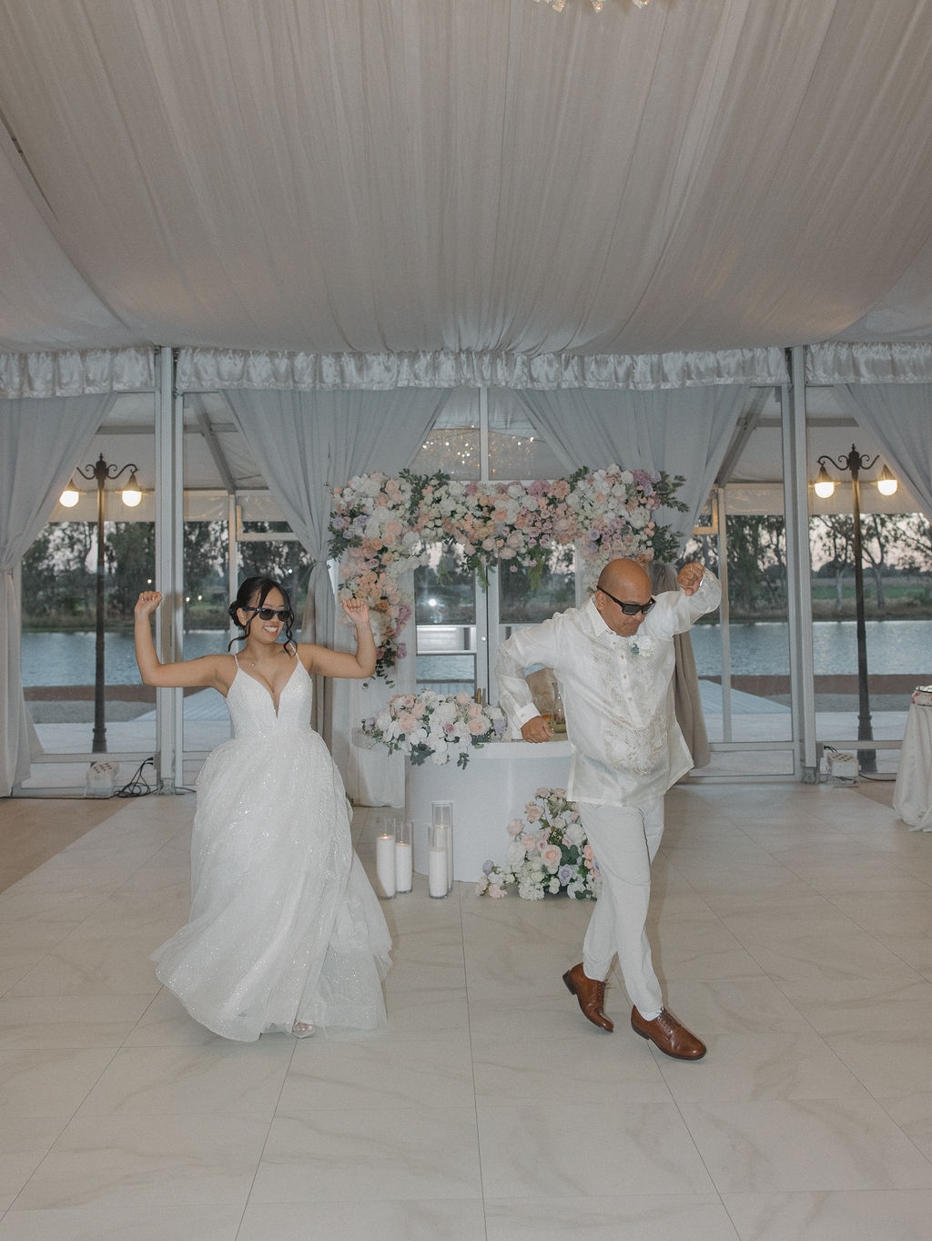 Bride and father having their first dance together in a candid wedding photo