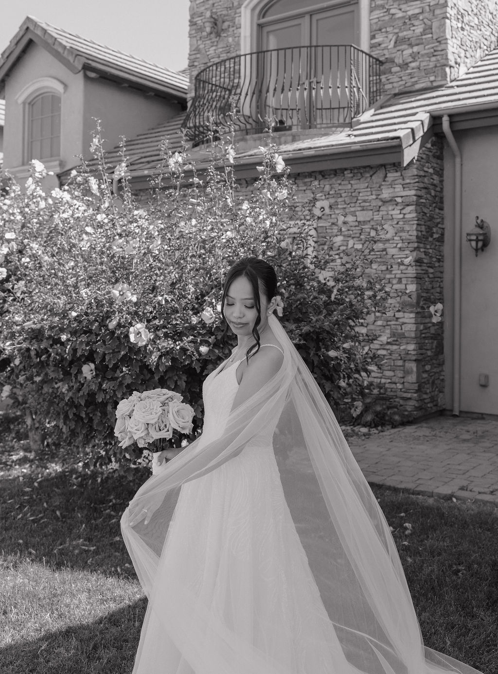 Black and white bridal portrait in front of the estate wedding venue