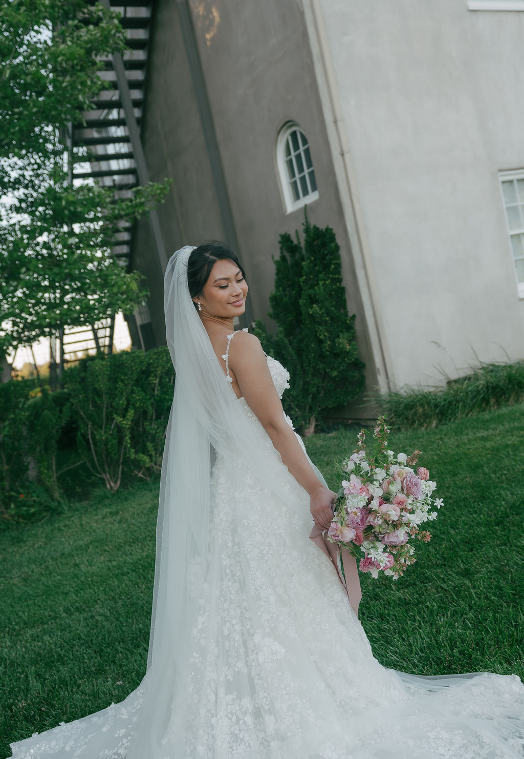 Bride looking down over her shoulder