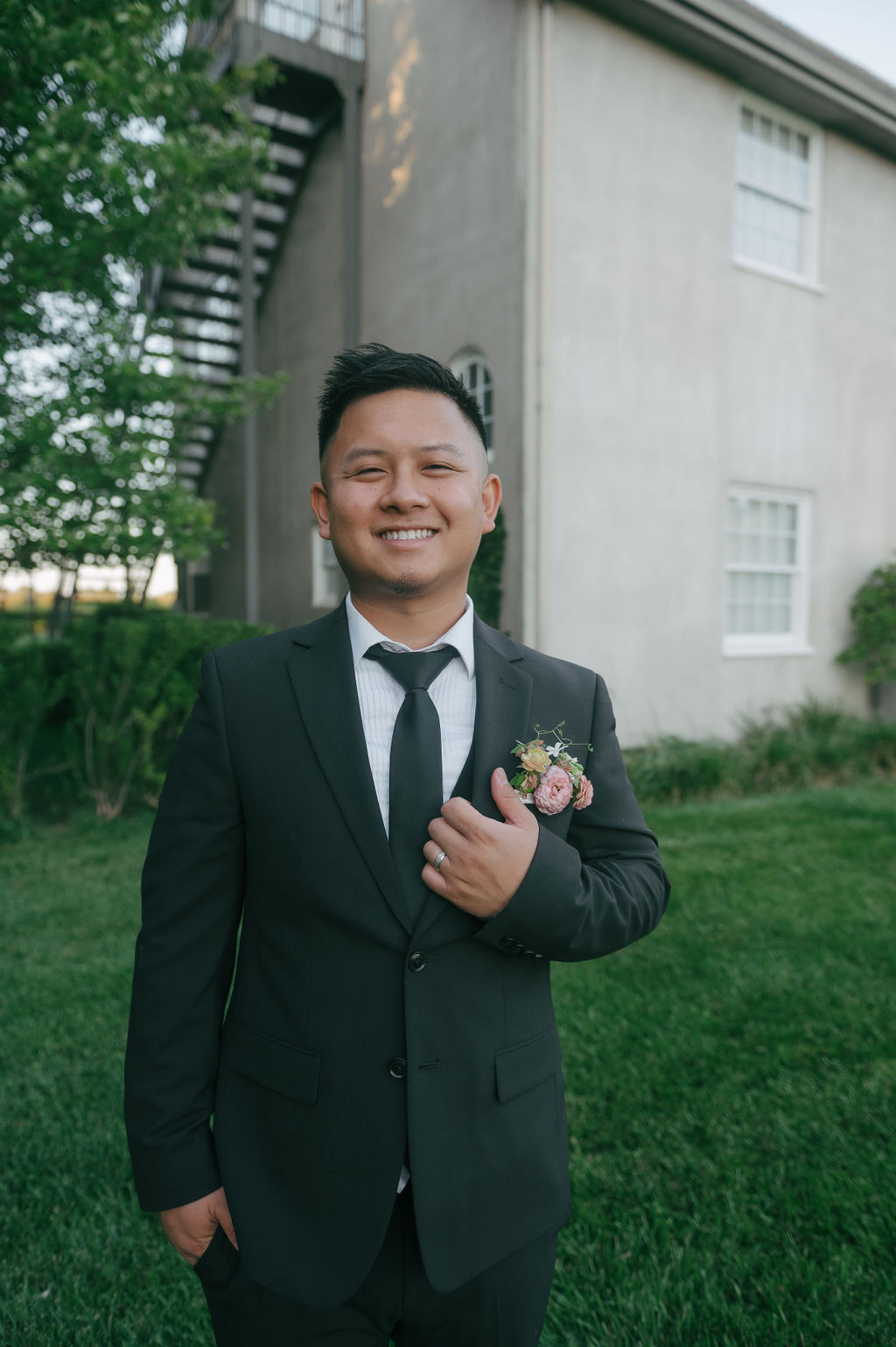 Groom smiling at camera