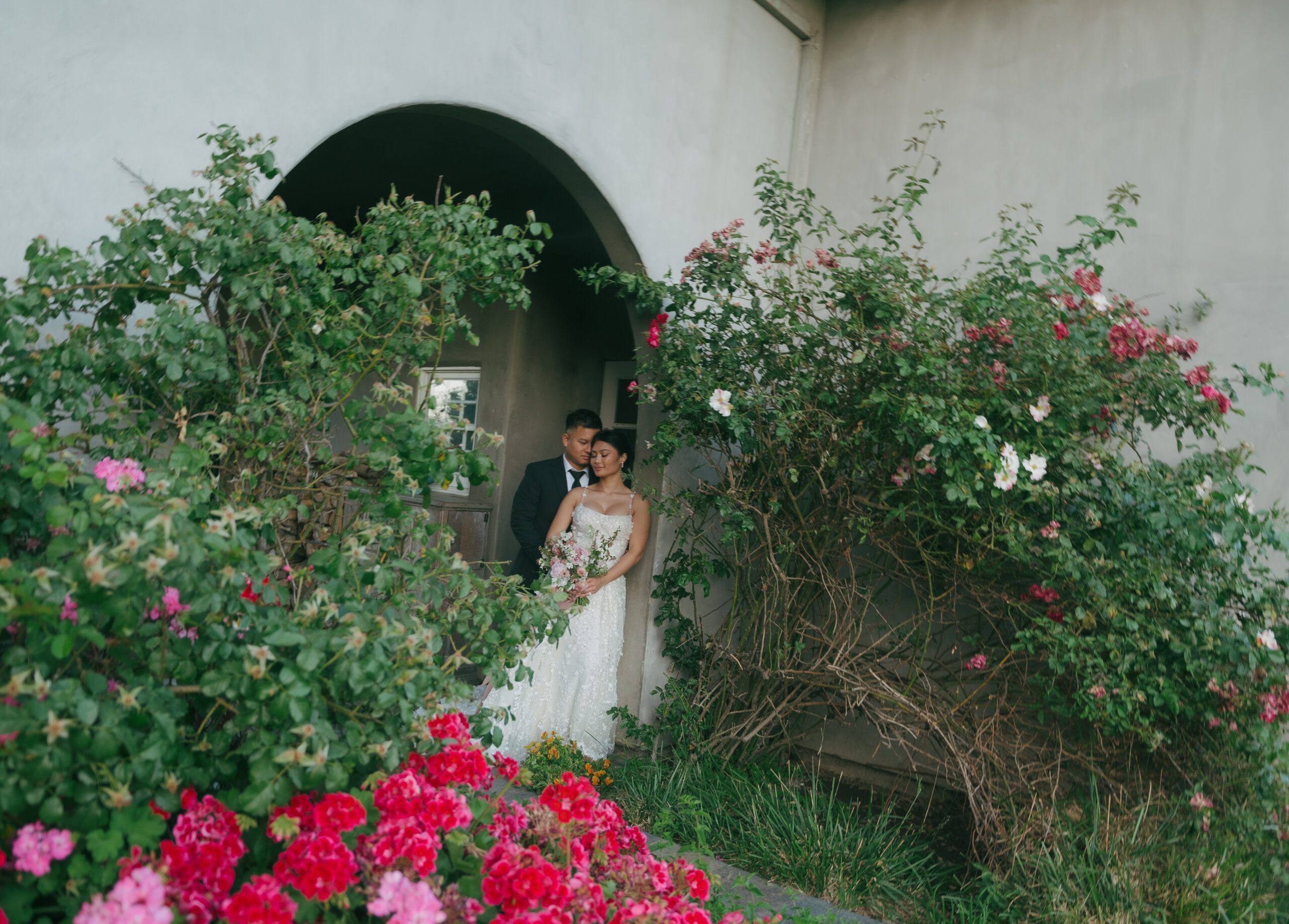 Wedding portraits in arch garden at Cavaignac Estates
