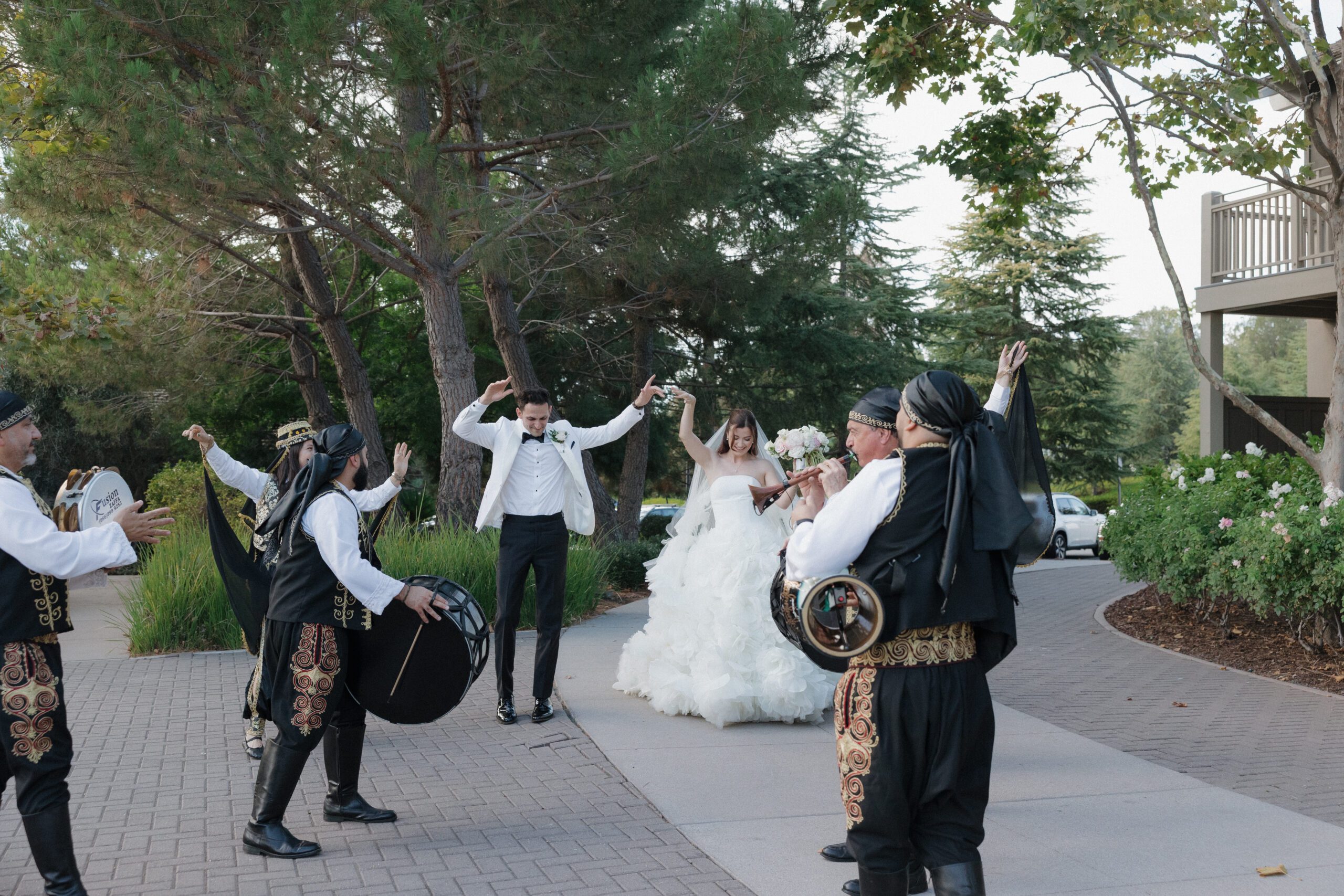 A live wedding band plays as bride and groom dance into their reception