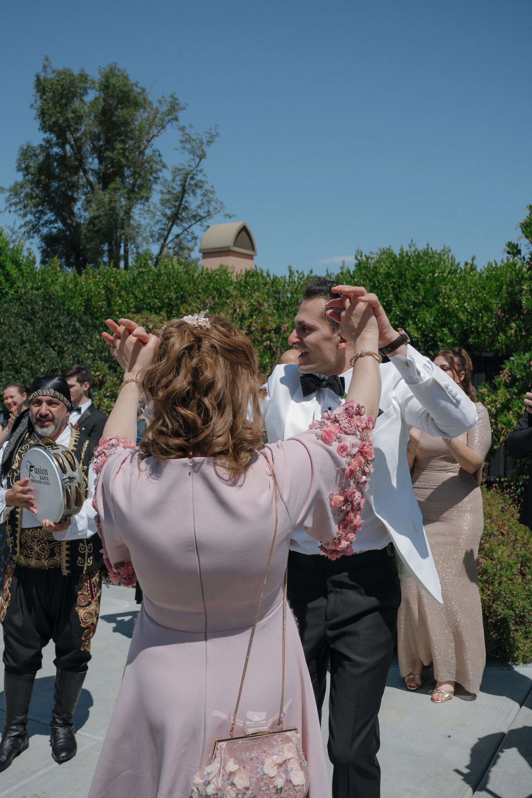 Bride and mother dancing at wedding reception